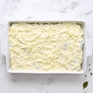 A white dish with a cheesy ricotta and parmesan.