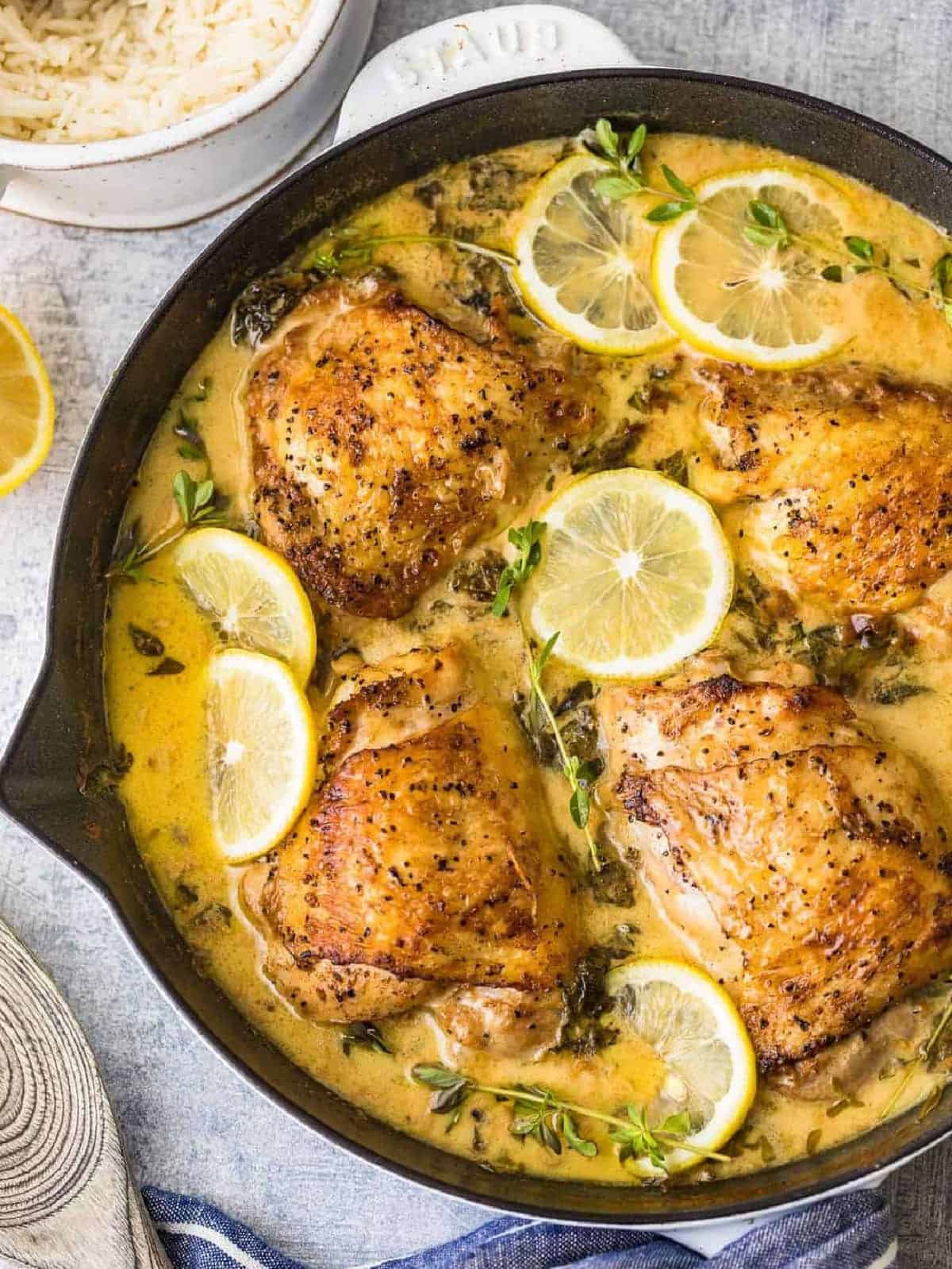overhead view of creamy lemon butter chicken in a skillet