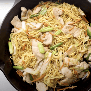 chicken chow mein in a pan.