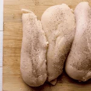 Four easy southwest chicken breasts on a cutting board.