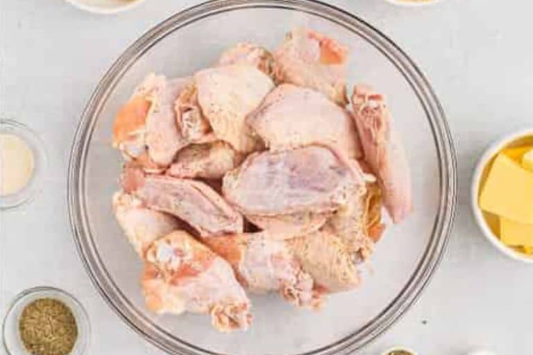 Chicken wings in a glass bowl.