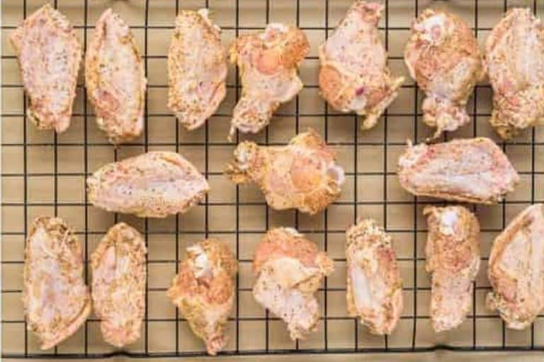 Chicken wings on a baking rack.