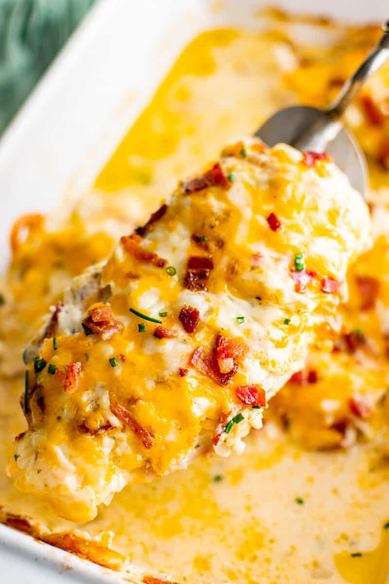lifting up ranch chicken with bacon