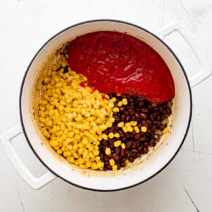 corn, beans, and tomatoes in a pot
