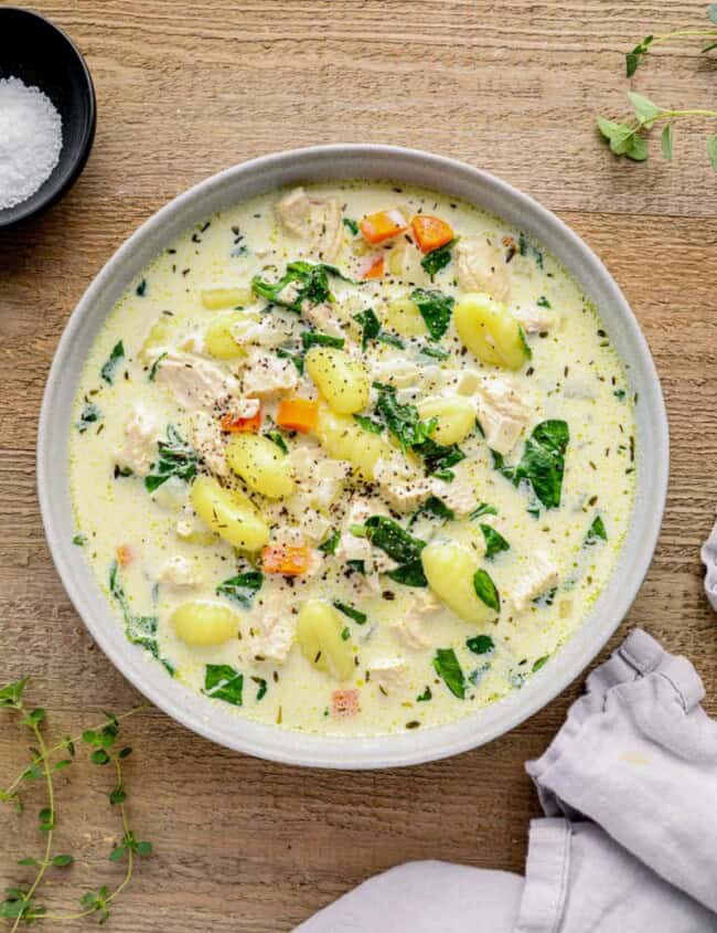 overhead image of chicken gnocchi soup in a bowl