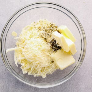 cheese and garlic filling ingredients in a glass bowl