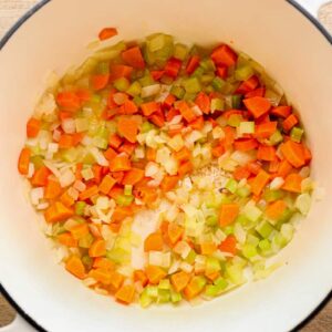 chopped carrots, celery, and onion in a white pot