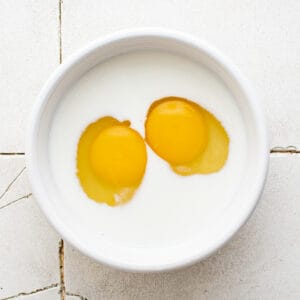 eggs and milk in a white bowl