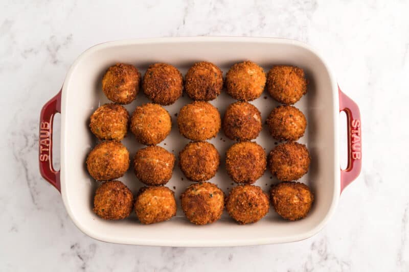chicken parmesan meatballs in a baking dish