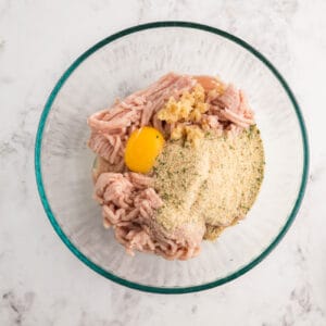 chicken meatball mixture in a glass bowl