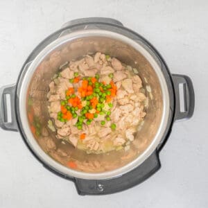 cooked chicken with carrots and peas in instant pot