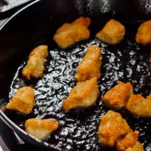 fried chicken pieces in a skillet