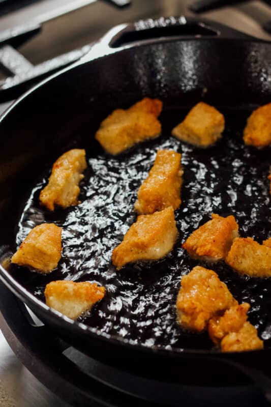 fried chicken pieces in a skillet