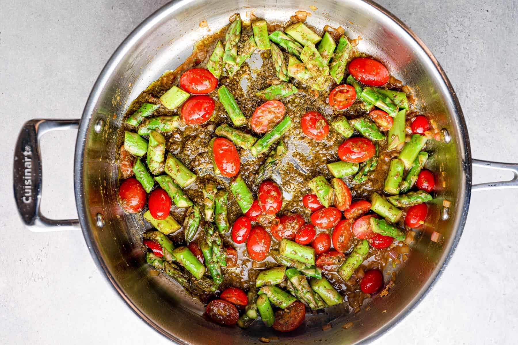 tomatoes and asparagus in a skillet