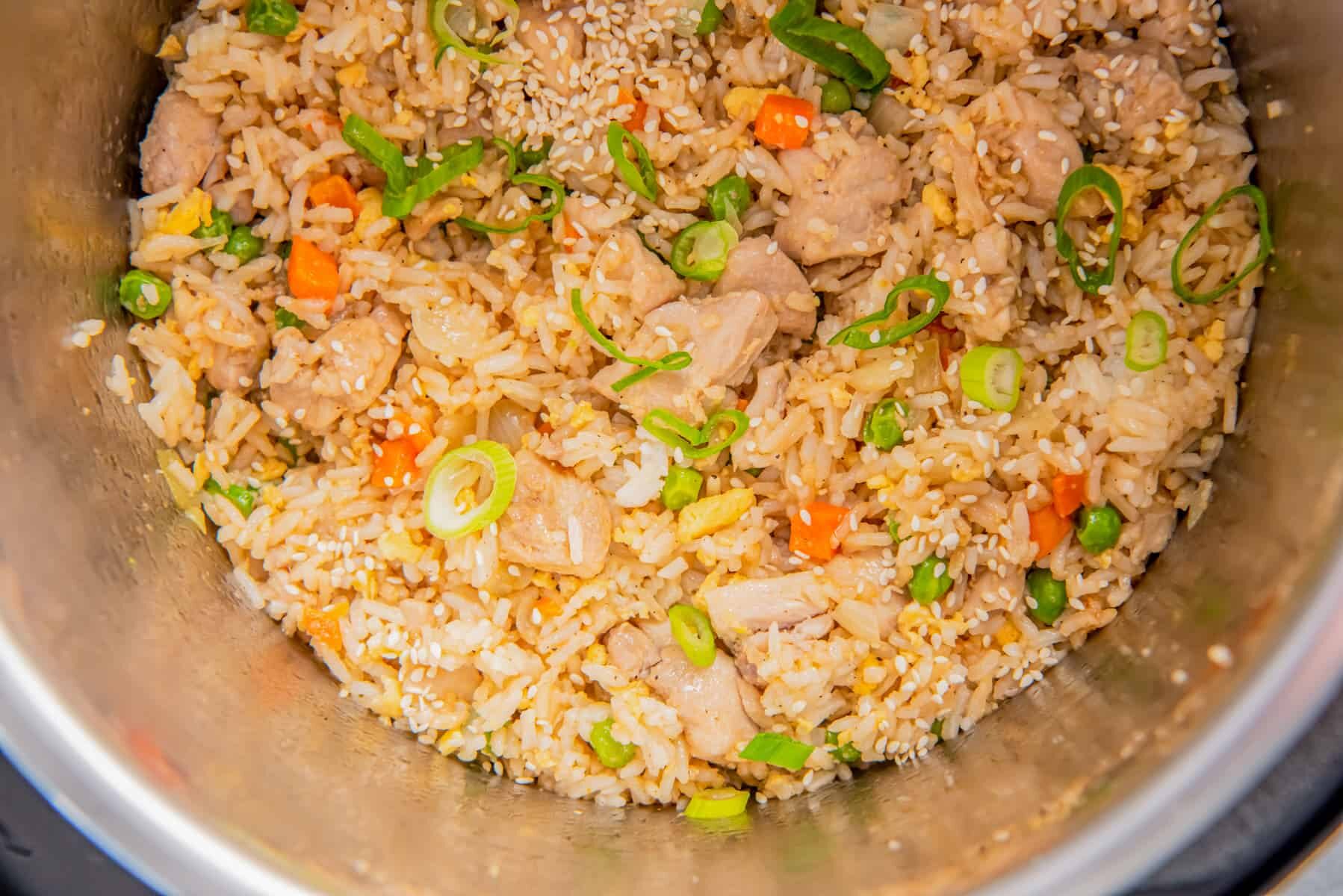 chicken fried rice topped with green onions in instant pot