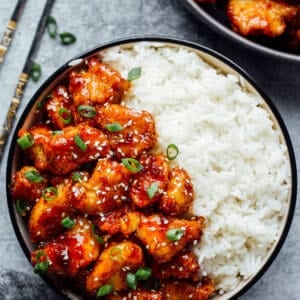 korean fried chicken with white rice in a bowl
