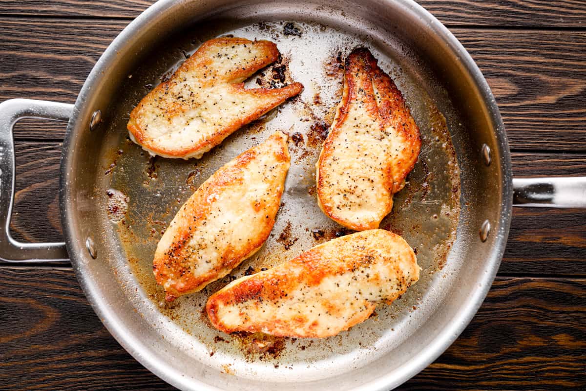 browned chicken breasts in a skillet