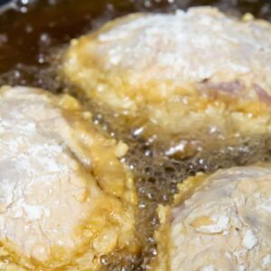 frying chicken in a pan