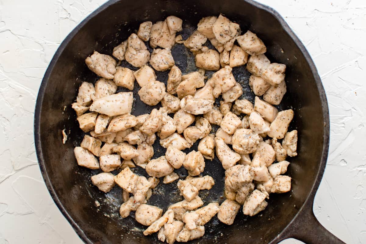 cooked chicken pieces in a skillet