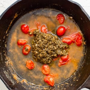 pesto, broth, and tomatoes in a skillet