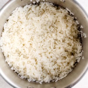 overhead view of cooked white rice in a saucepan.