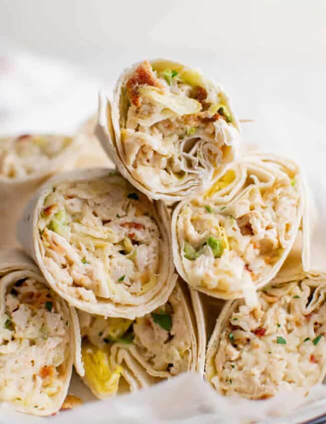 stack of chicken ranch wraps on a white plate