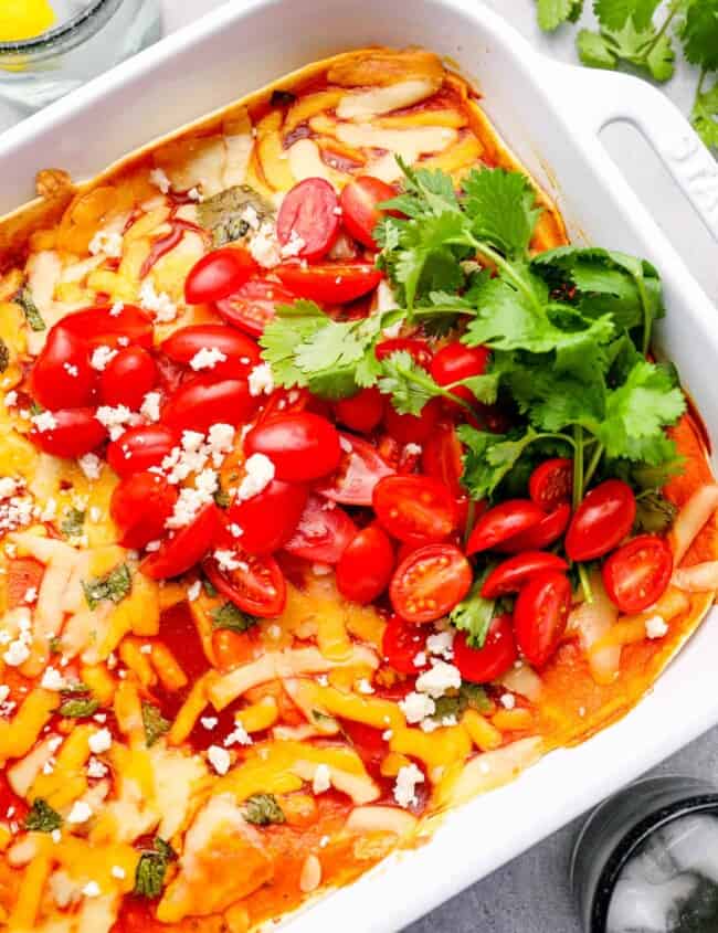 chicken tortilla bake in a white baking dish