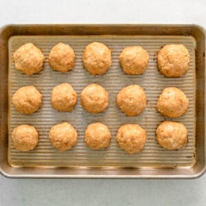 chicken meatballs on a baking sheet after baking