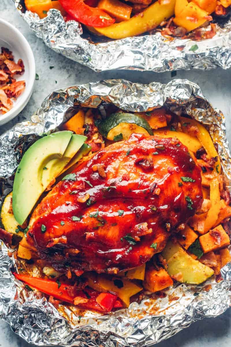 bbq chicken foil packets with avocado slices.