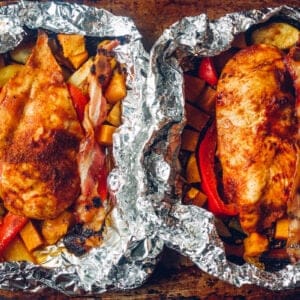 2 cooked bbq chicken foil packets.