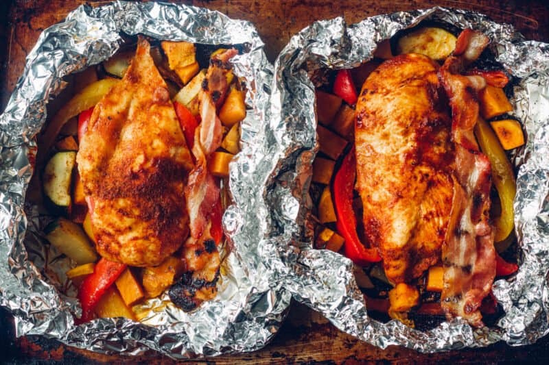 2 cooked bbq chicken foil packets.