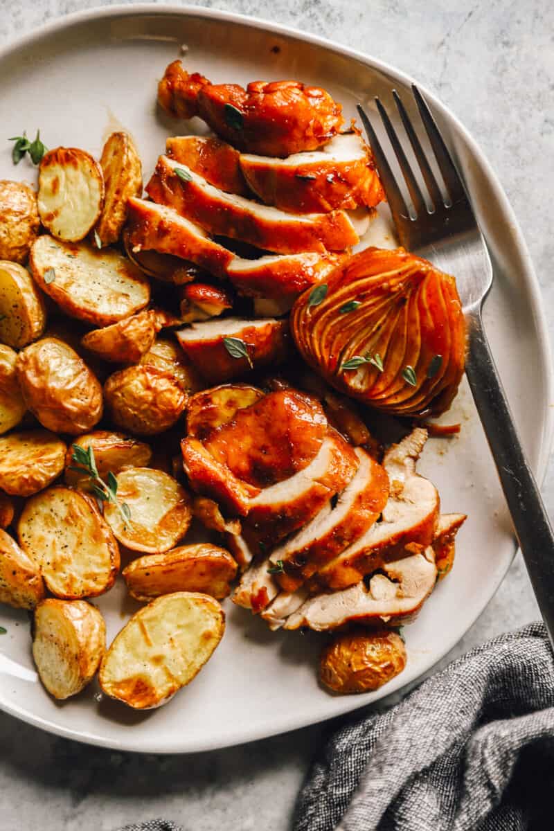 a plate of honey balsamic baked chicken and potatoes