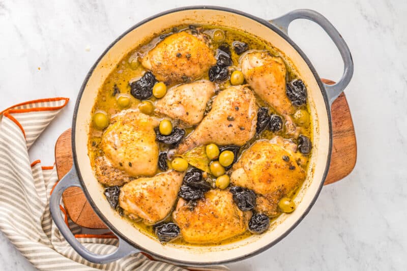 chicken marbella in a round pan.