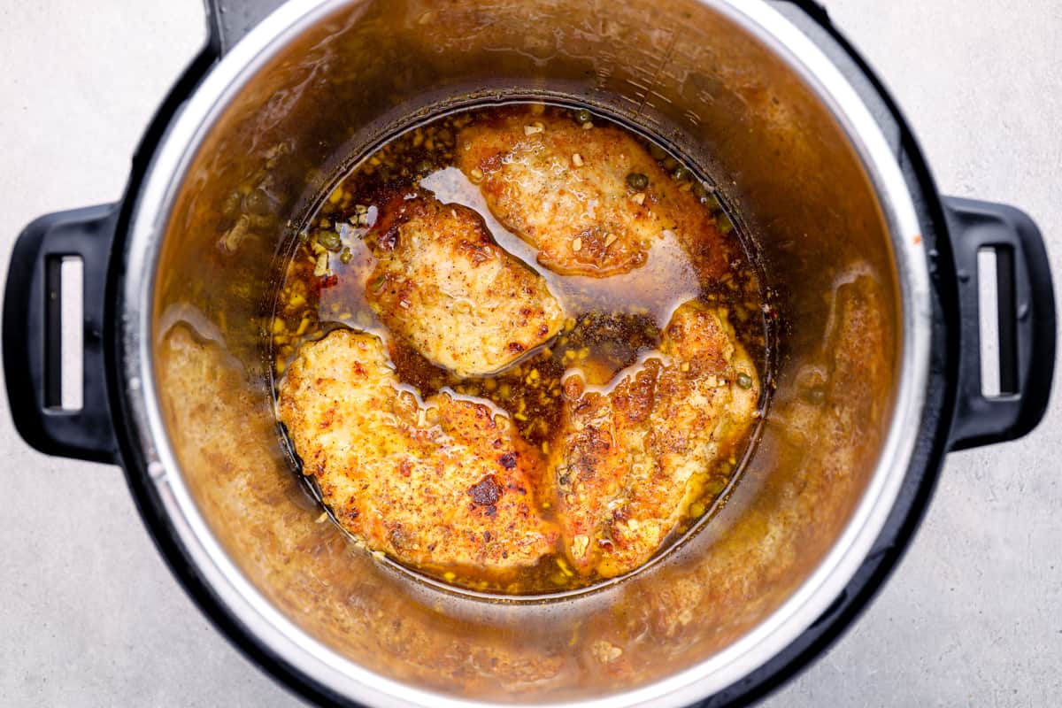 4 chicken breasts cooking in an instant pot.