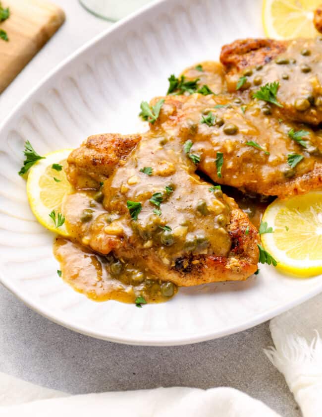 instant pot chicken piccata on a white serving tray.