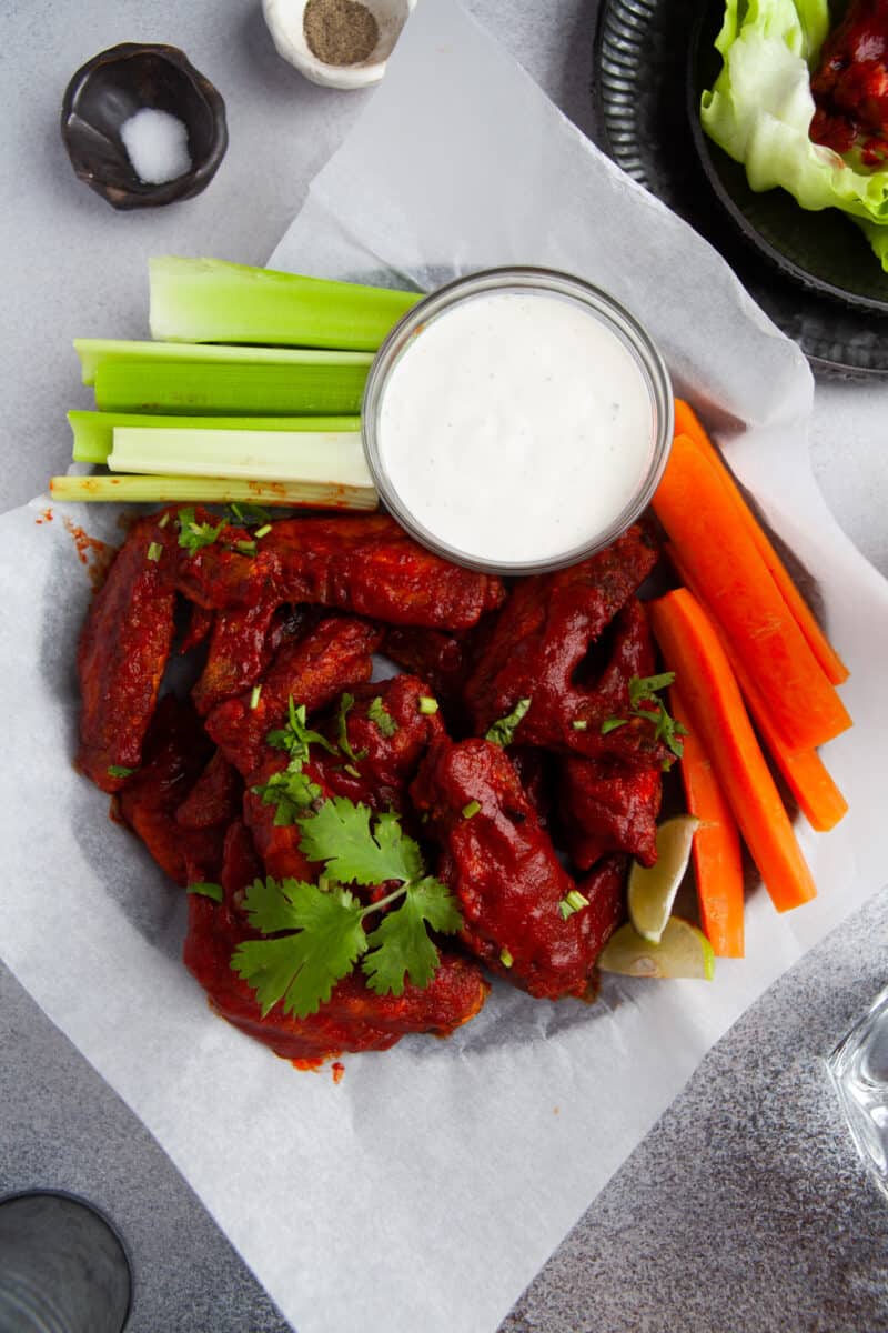 air fryer hot honey chicken wings with carrots and celery and ranch.