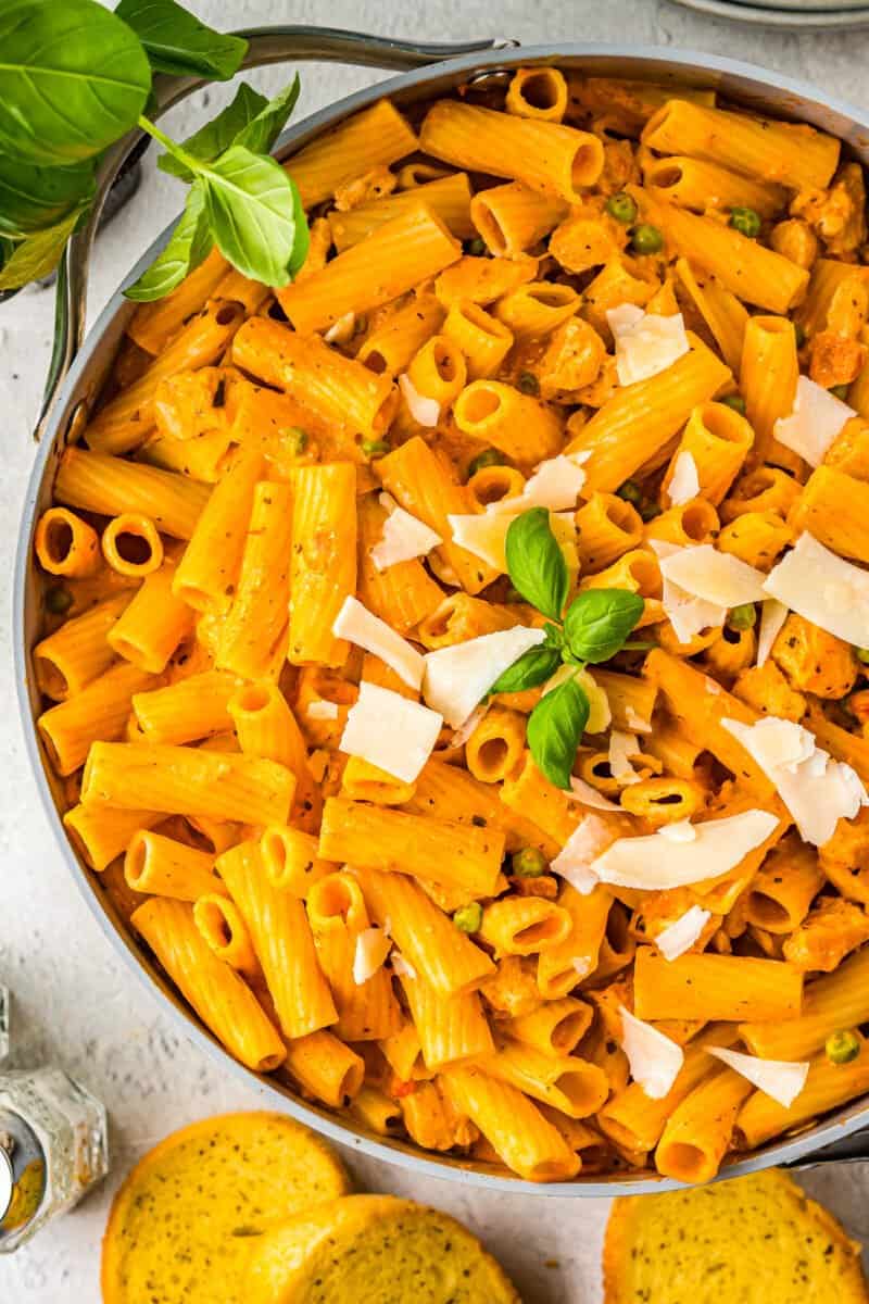 chicken rigatoni in a skillet with basil.