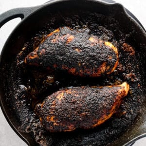 blackened chicken in a cast iron skillet