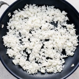a skillet filled with white rice