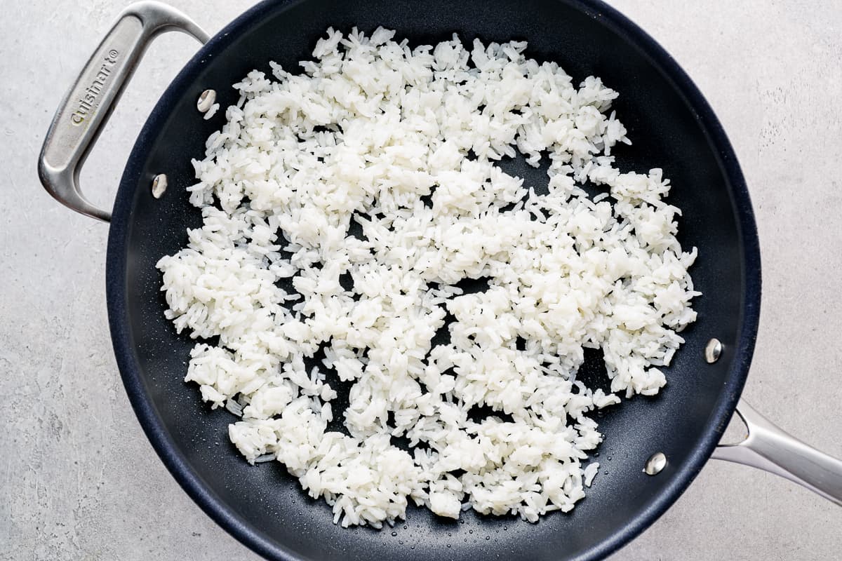 White rice frying in a pan.