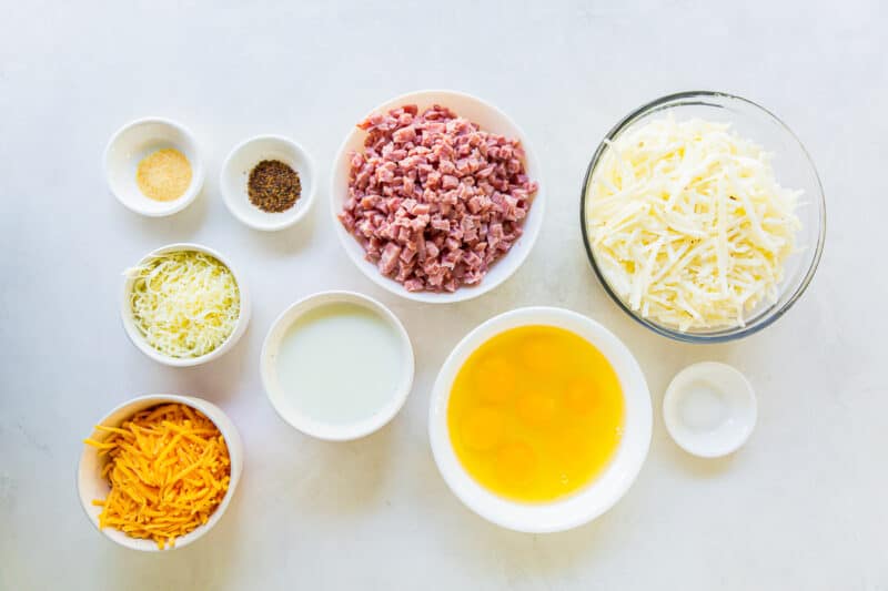 overhead view of ingredients to make ham and cheese breakfast casserole.