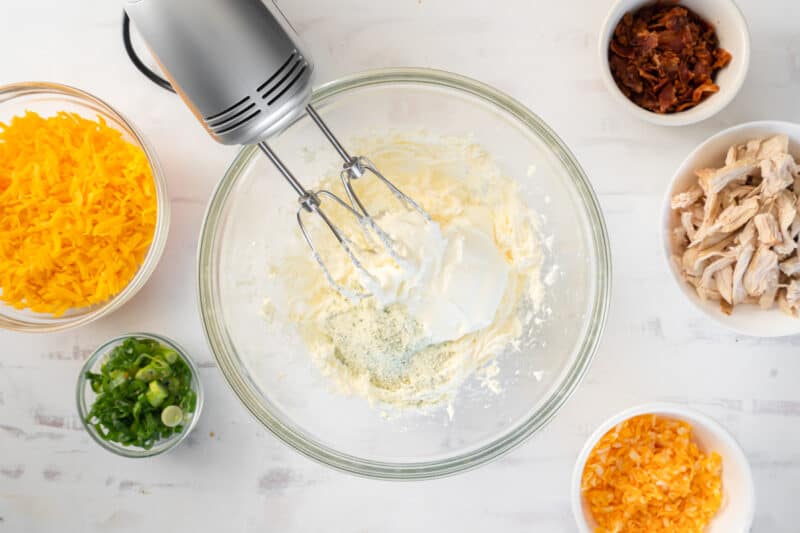 electric mixer combining ingredients in a bowl
