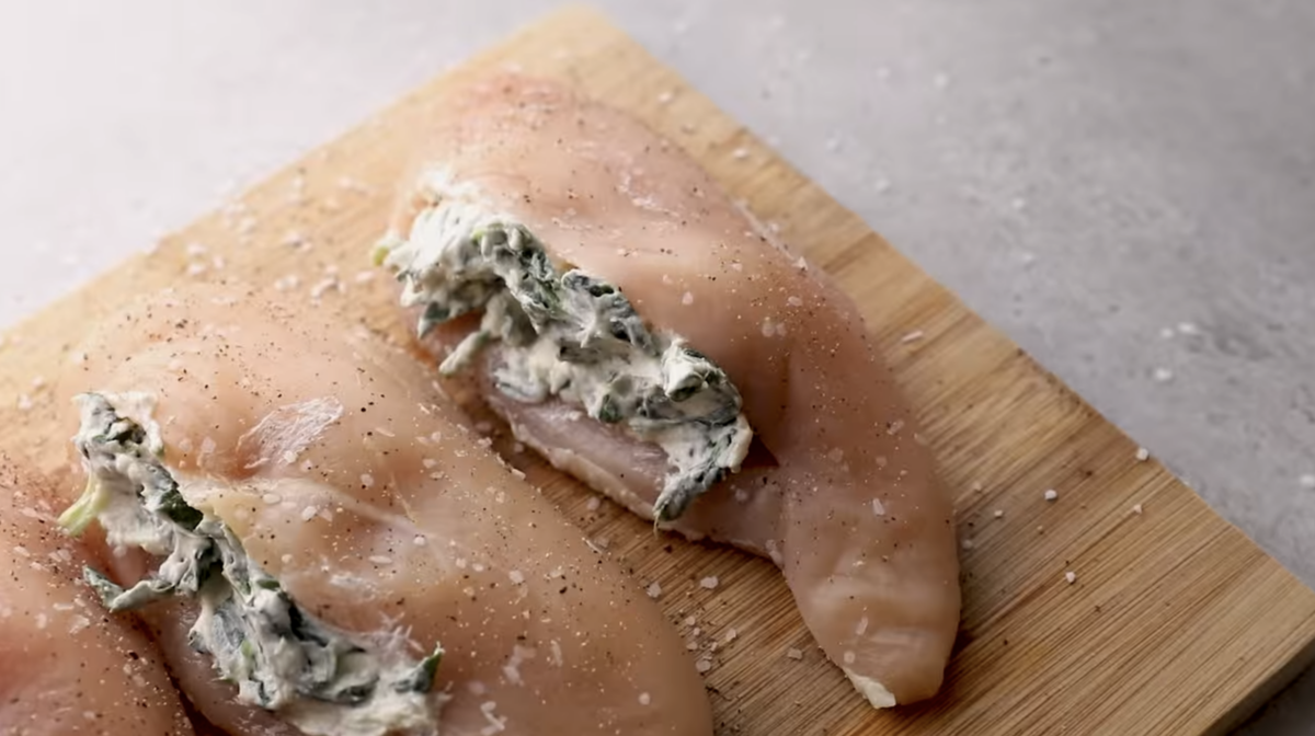 Chicken breasts are stuffed with spinach filling. 
