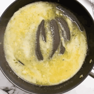 lemon butter sauce in a skillet.