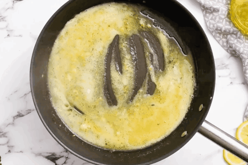 lemon butter sauce in a skillet.