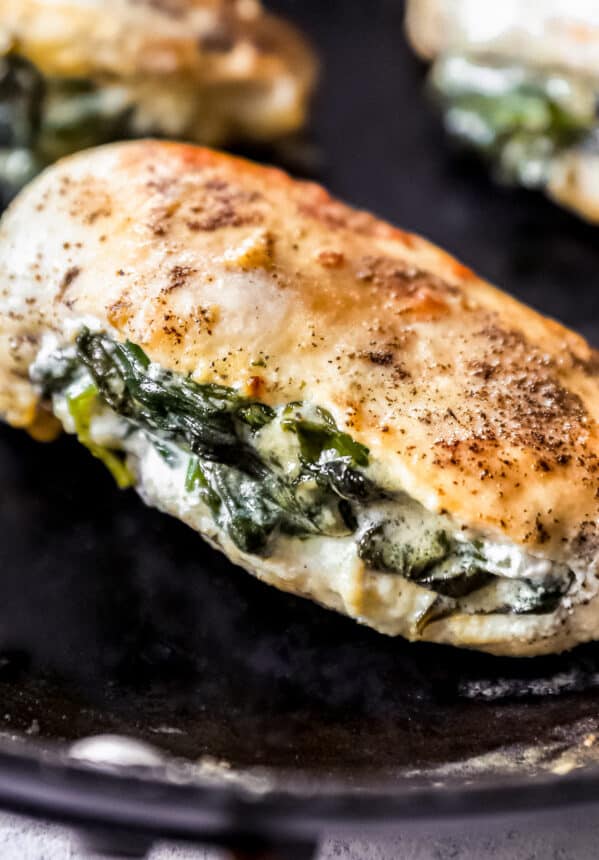 close up on chicken breast stuffed with spinach and cream cheese
