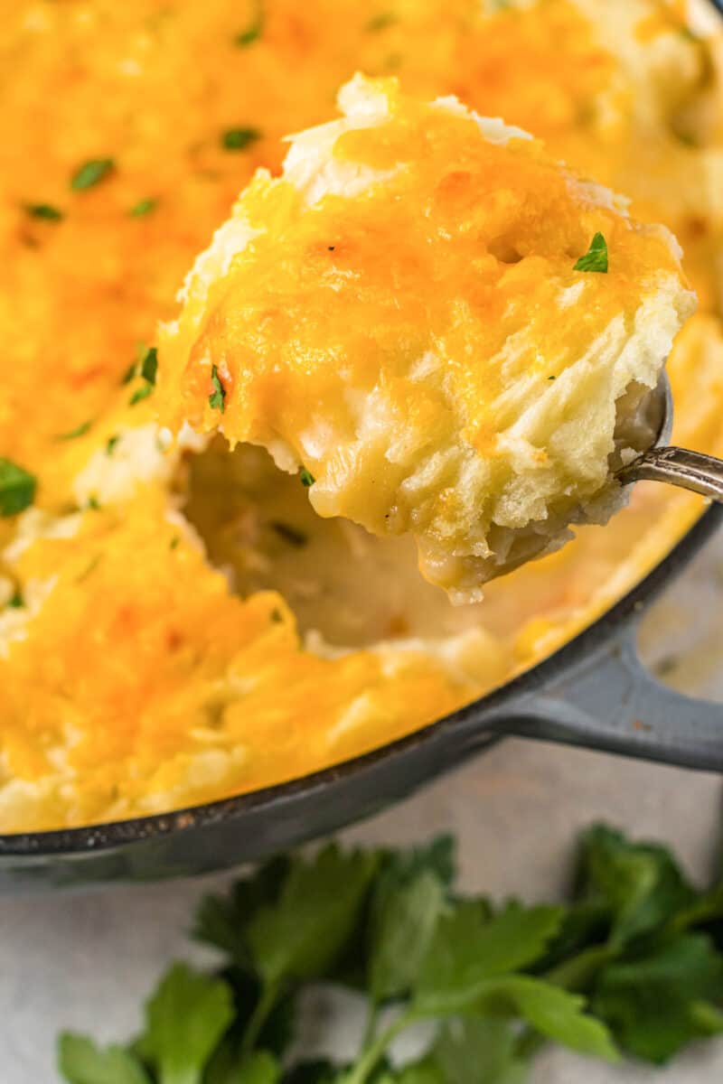 close up on a scoop of chicken shepherds pie