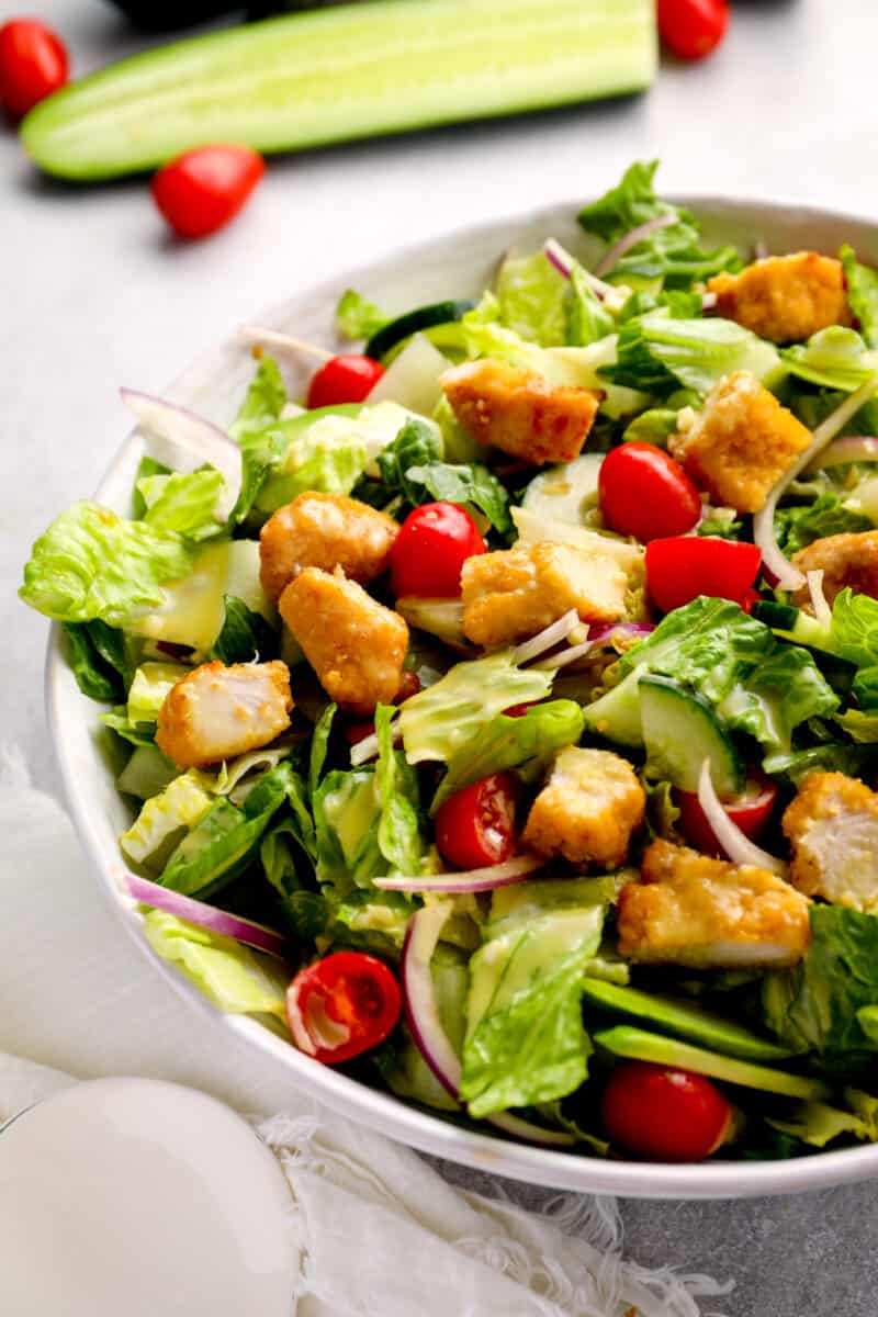 salad tossed with tomatoes, onions, croutons, and more
