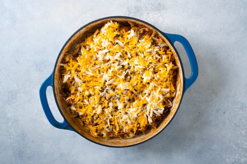 chicken enchilada filling topped with shredded cheese