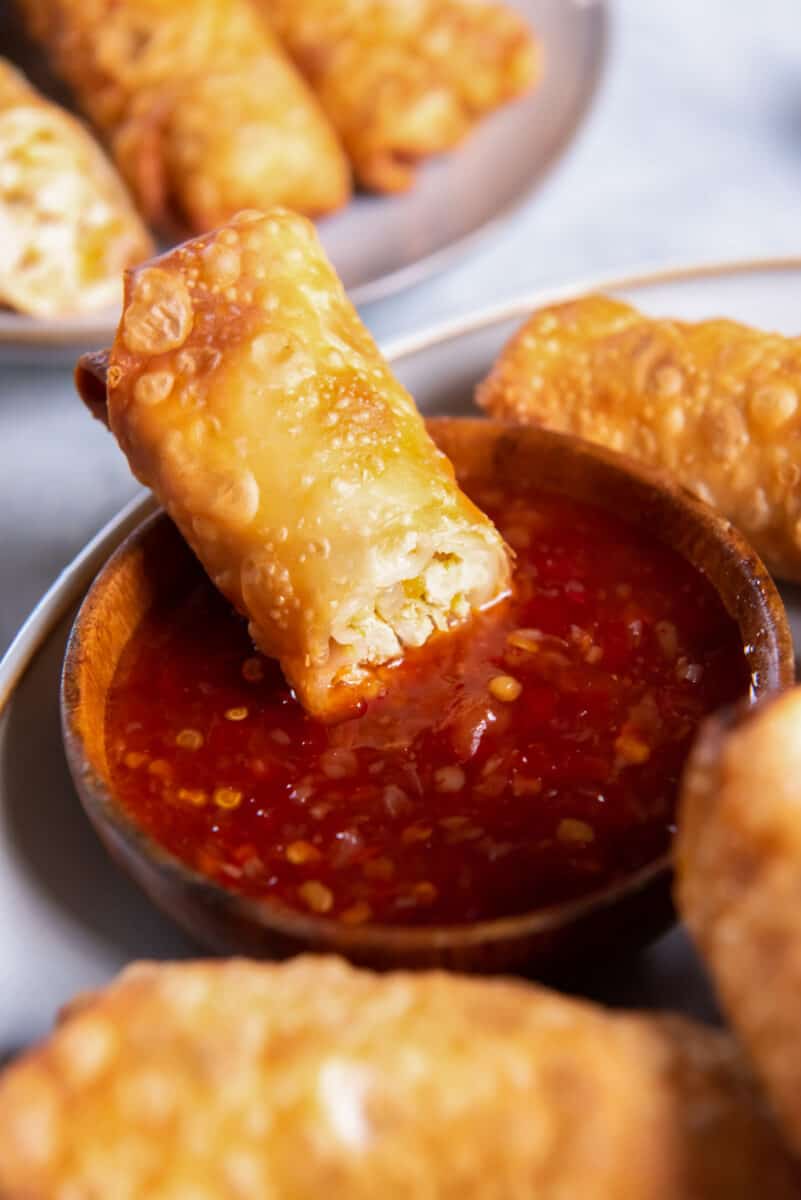chicken egg roll dipped in sauce